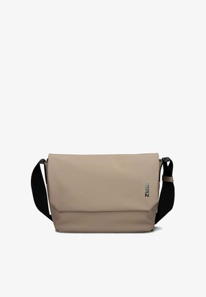 Beige messenger bag with black adjustable shoulder strap, rectangular shape, and subtle logo on front flap.
