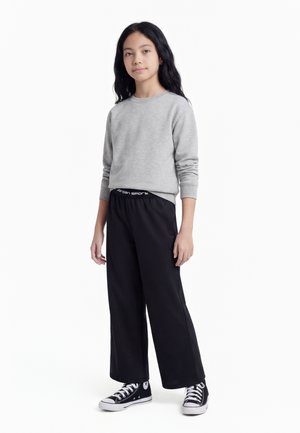 Jordan PERFORM SPORT WOVEN - Tréningruha alsók - black