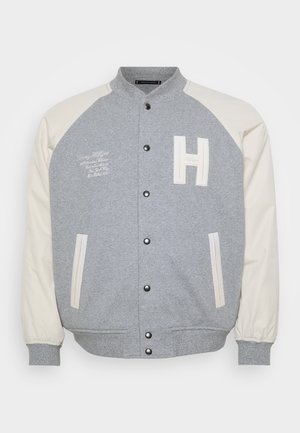 Graue Collegejacke mit elfenbeinfarbenen Ärmeln, Druckknöpfen und gestickten Details. Verfügt über Fronttaschen und ein großes "H"-Emblem auf der Brust.