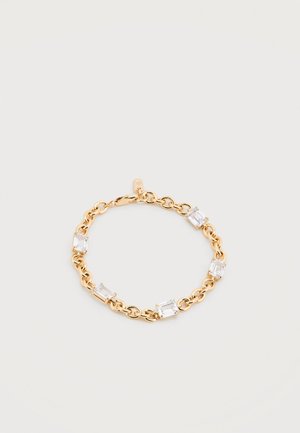 Gold chain bracelet with five rectangular clear gemstones evenly spaced and a lobster clasp closure on a white background.