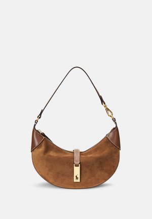 Brown suede handbag with a curved shape, leather accents, gold hardware, and a zip closure. Features a prominent logo plate.