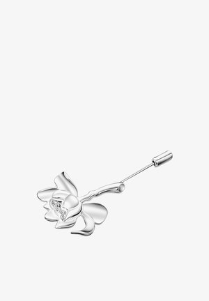 Srebrna broszka w kształcie kwiatu z płatkami i łodygą. Gładka, refleksyjna powierzchnia; prosty design bez dodatkowych wzorów czy ozdób.