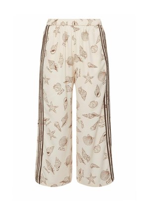 Cremafarbene Hosen mit weitem Bein, bedruckt mit braunen Meeresschalen und Seesternen sowie dunkelbraunen vertikalen Streifen an den Seiten.