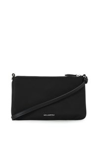 Sac bandoulière en nylon noir avec fermeture éclair, texture lisse et une fine sangle réglable. Présente un logo en bas à l'avant.