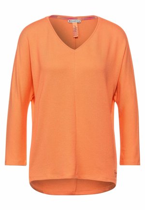 Stickad tröja - orange