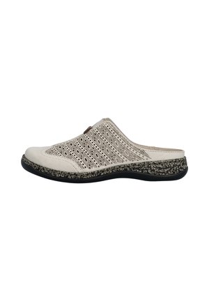 Sandale beige à enfiler avec un design découpé noir à motifs et une semelle noire texturée avec des taches beiges, vue de côté.