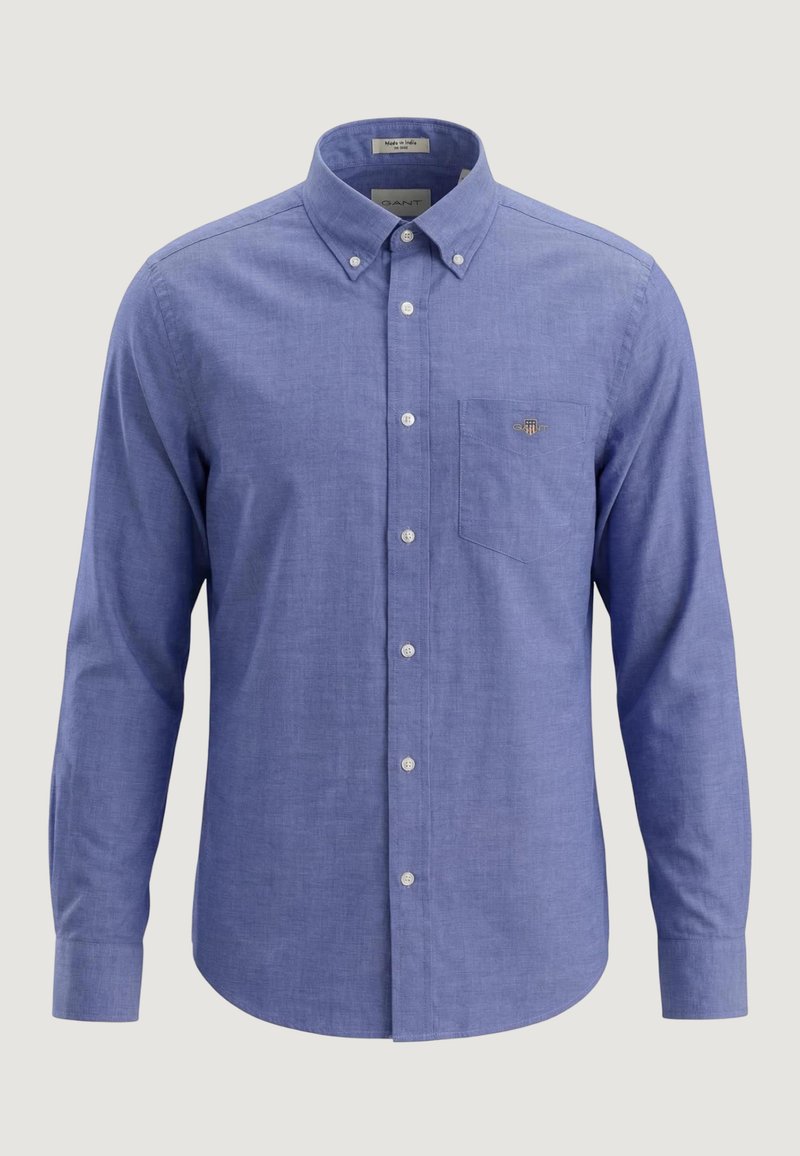 Chemise Oxford bleue à manches longues, boutonnée, avec col boutonné et poche poitrine ornée d'un petit logo brodé.