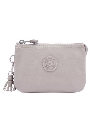 Gray nylon zippered pouch with a textured finish, featuring a round logo and a monkey-shaped zipper pull attached.