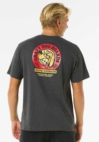Gray cotton t-shirt featuring a bold, colorful dog logo in a circular design with "Crazy Dog Boards" and "Ripcurl Surfboards" text.