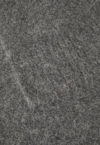 Gray felt material with a soft texture, featuring a mix of light and dark gray fibers, displaying a dense and uniform coverage.