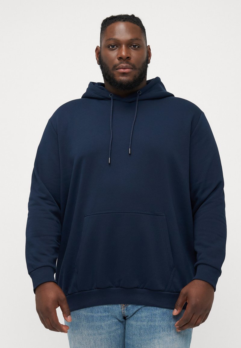 Donkerblauwe sweatshirt met een trekkoordcapuchon, voorzak met kangoeroe-stijl en geribbelde manchetten. Gemaakt van zachte stof met een ontspannen pasvorm.