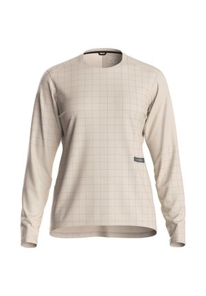 Chemise beige à manches longues avec motif à carreaux subtil et col rond, présentée sur fond blanc uni.