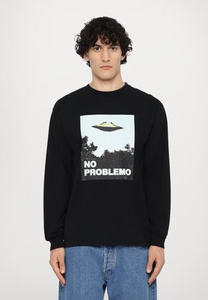 Black long-sleeve t-shirt featuring a graphic with a UFO and the text "NO PROBLEM." Cotton fabric with a relaxed fit and crew neck.