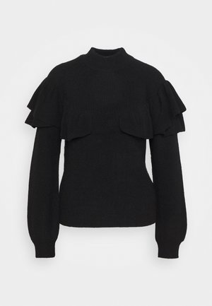 Schwarzer, gestrickter Pullover mit langen Ärmeln, hohem Kragen und gestuften Rüschendetails über den Schultern und dem oberen Brustbereich.