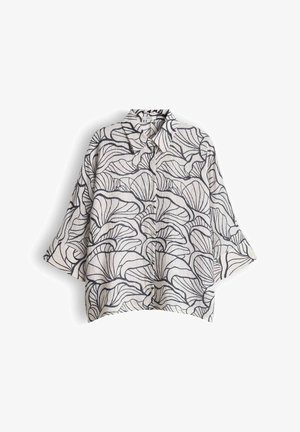 Wit overhemd met knopen, brede mouwen en een groot zwart abstract bladmotief over het hele oppervlak.