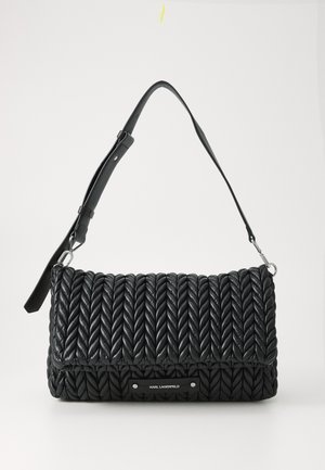 Black woven shoulder bag with a textured pattern, a detachable strap, and a silver logo plate on the front. Made from leather.
