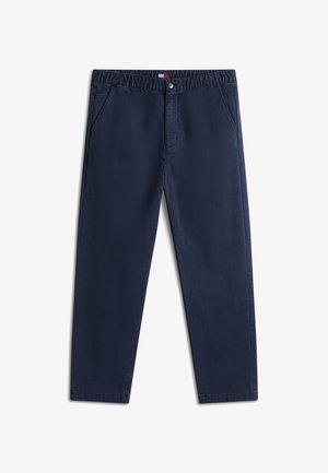 Tumesinised vabaaja püksid küljetaskutega, nööpidega kinnitatav ja väikese logomärgiga vöökohal keskosas.