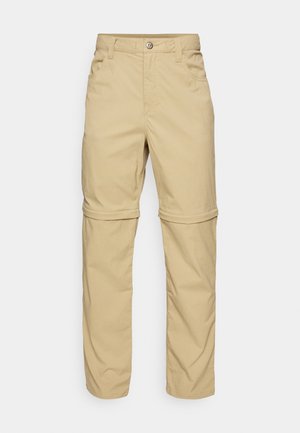 Šviesiai rudos kelnių su užtrauktuku, turinčių lygų paviršių, su dviem šoninėmis kišenėmis, mygtuko uždarymu ir sukabinamais kelnių galais, kad būtų galima naudoti įvairiai.