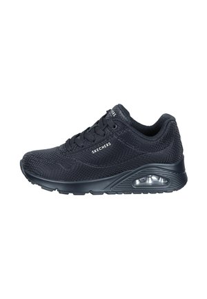 Scarpe da ginnastica nere con tomaia in mesh testurizzato, punta arrotondata e suola ammortizzata con un'unità d'aria visibile. Lacci per una vestibilità sicura.