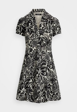 Abito a fiori in bianco e nero con collo a camicia, maniche corte a sbuffo e gonna svasata, realizzato in un tessuto leggero.