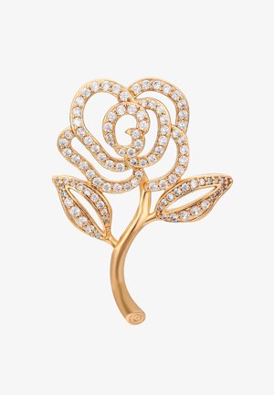 Goldfarbene Rosennadel mit klaren runden Kristallen, die Blütenblätter und Blätter umreißen, auf weißem Hintergrund.