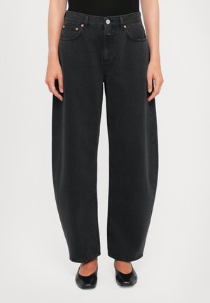 High-waisted, wide-leg black denim jeans with a smooth texture, five pockets, and copper hardware accents. Classic straight cut at the hem.
