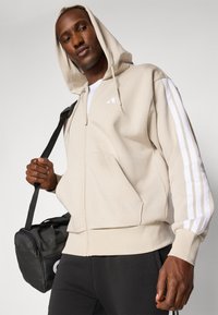 adidas Sportswear Bluză de molton cu fermoar - offwhite