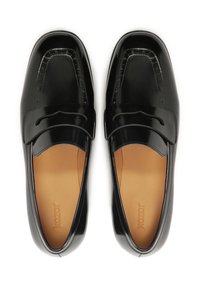 Black loafers made of glossy leather, featuring a sleek design, decorative stitching, and a rounded toe. Interior is tan leather.