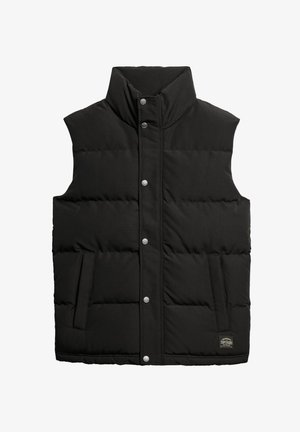 Gilet rembourré sans manches noir avec un col haut, des boutons-pression à l'avant, des poches latérales et un tissu texturé subtil. Présente un patch logo.