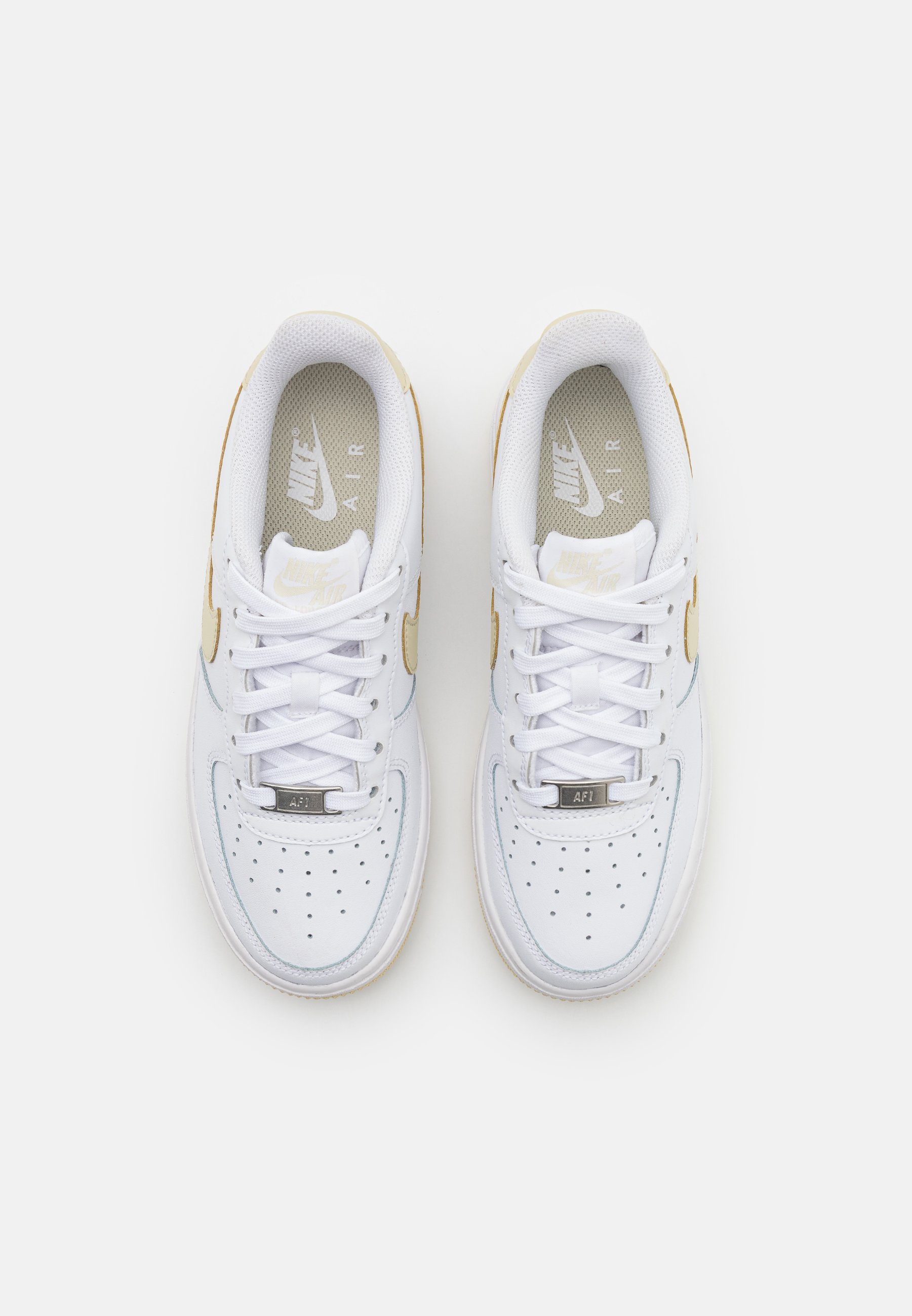 white nike air force with yellow tick