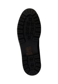 Suola di scarpa in gomma nera con un battistrada a motivo, caratterizzata da impugnature esagonali e rettangolari, e un piccolo etichetta con le istruzioni per la cura.