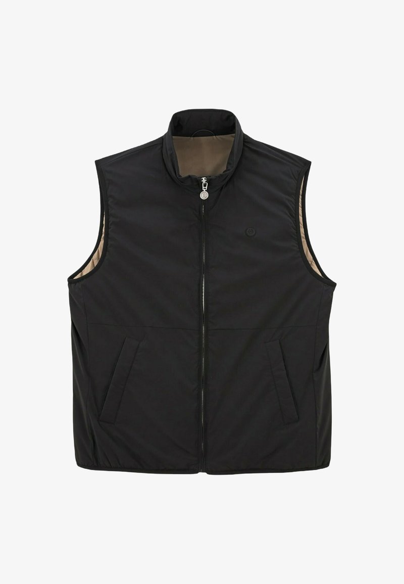 Chaleco negro sin mangas con cuello alto, cierre de cremallera completo, dos bolsillos frontales y un forro interior beige. Tejido suave con un detalle mínimo.