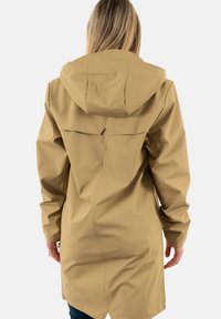 Khaki raincoat with a hood, long sleeves, and a relaxed fit. Features smooth, waterproof fabric and a back vent for ventilation.