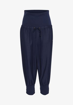 Granatowe joggery ciążowe z elastycznym wysokim pasem, sznurkiem z przodu, luźnym krojem i marszczonymi mankietami przy kostkach.