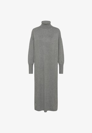 Grå, långärmad klänning i mjukt stickat material. Har en hög polokrage och en avslappnad silhuett som når ner under knäet.