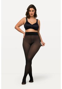 Collants opaques noirs avec une texture lisse et une large ceinture, accompagnés d'un soutien-gorge noir assorti avec des bretelles ajustables et un décolleté arrondi.