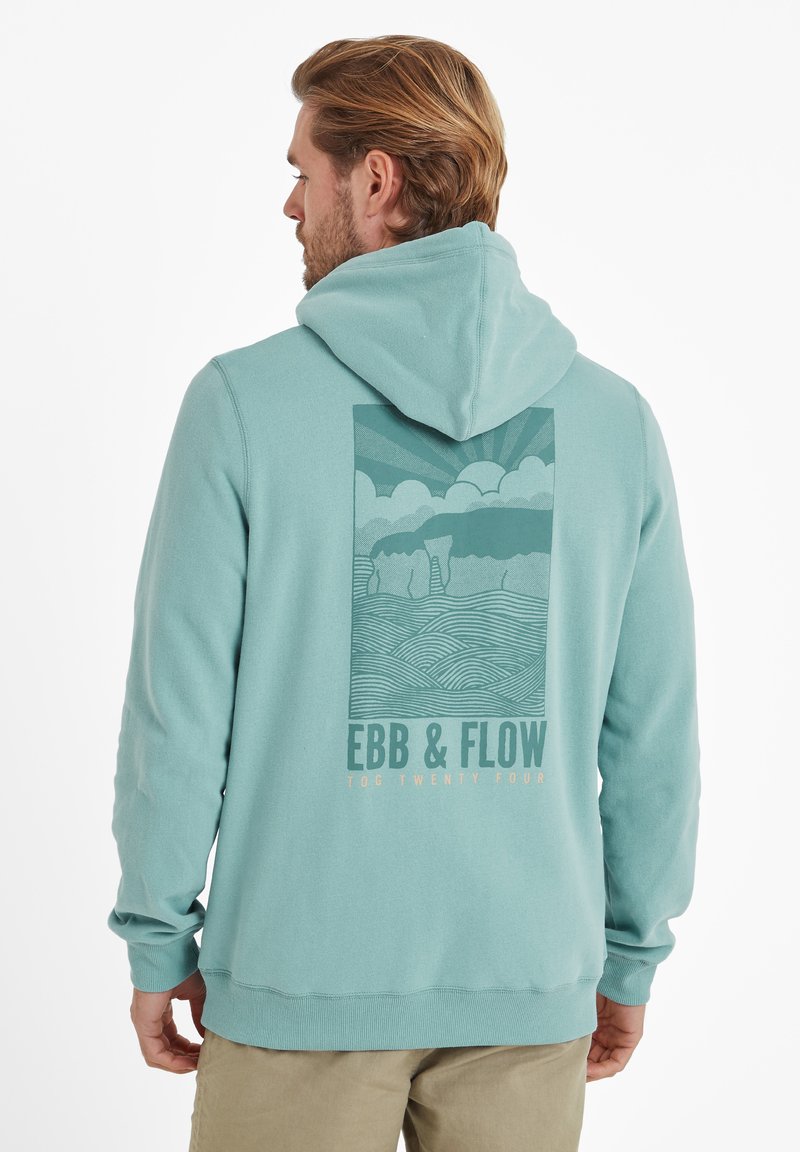 Light teal hoodie with a drawstring, featuring a graphic of clouds and waves in muted tones on the back, with "EBB & FLOW" text.