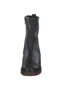 Black leather ankle boot with a smooth finish, side zipper, pull tab at the collar, and a flat rubber sole. Elegant, simple design.