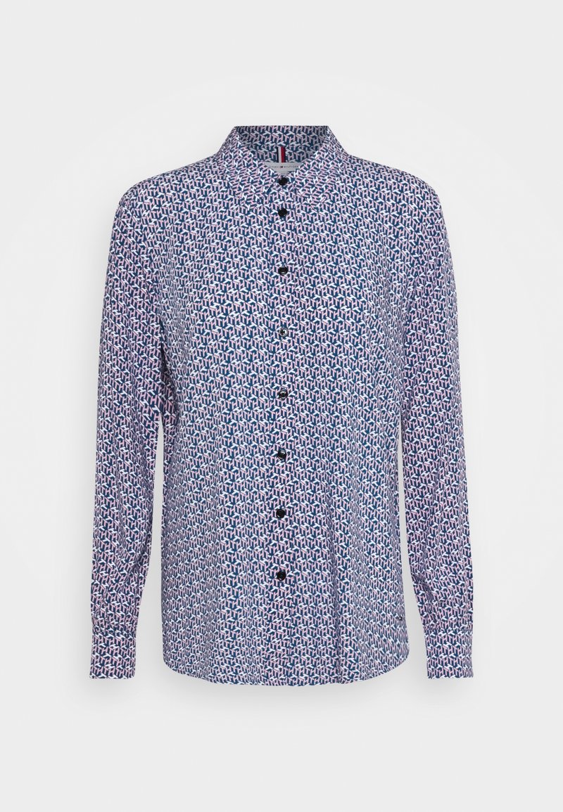 Chemise à manches longues boutonnée avec un motif géométrique bleu, blanc et rose et un col pointu.