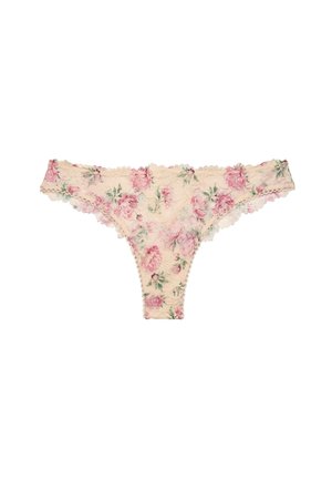 Cream lace thong underwear with a pink rose floral pattern and scalloped edges laid flat on white background.