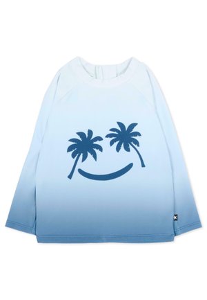 Niebieska koszula z długim rękawem z efektem gradientu, z dwoma granatowymi palmami i zakrzywioną linią tworzącą uśmiech na przodzie.