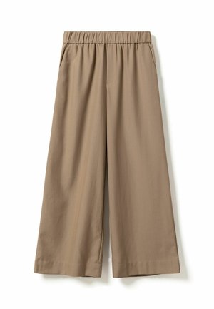 Weit geschnittene Hose aus einem weichen beigen Stoff, mit elastischem Bund, Seitentaschen und glatter Textur. Keine sichtbaren Muster oder Verzierungen.