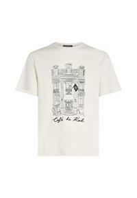 Cremefarvet bomulds T-shirt med en sort skitse af en cafébygning, der har teksten "Café de Karl" og intrikate arkitektoniske detaljer.