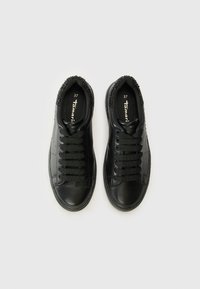 Black leather sneakers with rounded toes, lacing, and textured black accents around the collar. Size 37 printed inside.