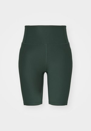 Gari augsta jostasvietas velotriķi tumši zaļā krāsā, izgatavoti no elastīga auduma. Piedāvā gludu tekstūru, plakanas šuves un piegulošu dizainu.