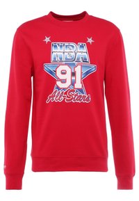 Sweat-shirt rouge à manches longues avec le texte « NBA 91 All-Stars », des étoiles argentées, et un grand graphisme d'étoile bleue au centre.