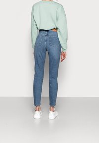 NA-KD Tall Relaxed fit -farkut - light blue