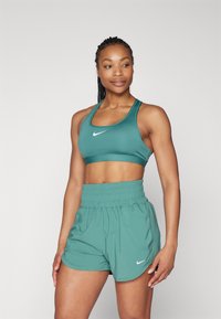 Nike Performance - BRA - Športni modrček s srednjo podporo - bicoastal/white Miniaturna slika 1