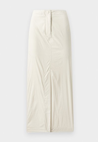 Lys beige, kneelengde skjørt laget av myk, teksturert stoff. Har en frontsplitt og en knappåpning i livet.