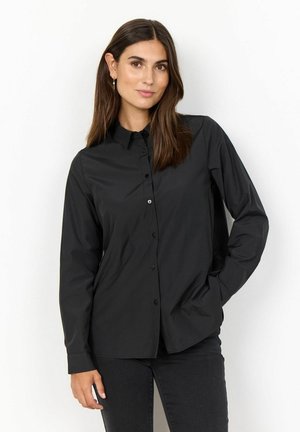 Black long-sleeve shirt with a button-down front, featuring a collar and smooth fabric texture. Worn with black pants.